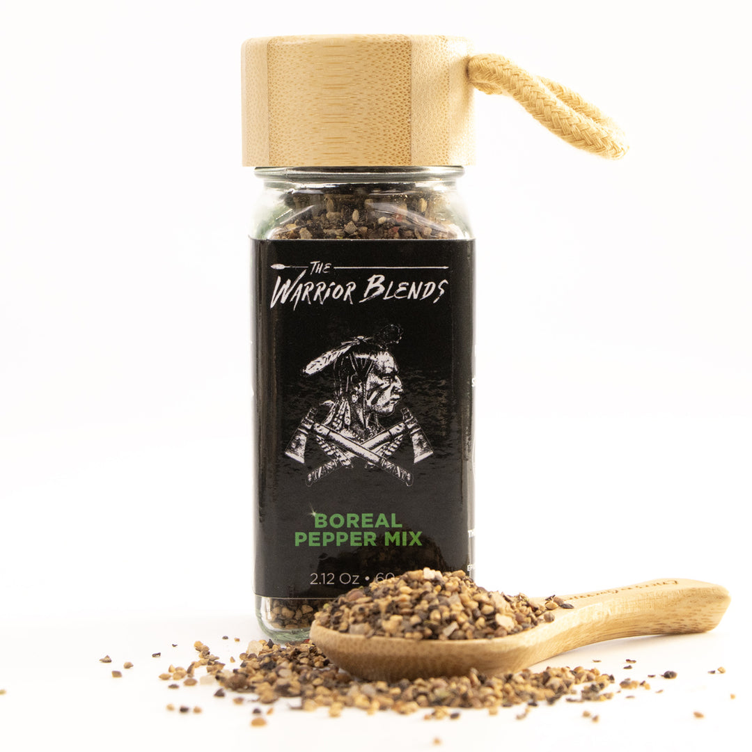 Boreal Pepper Mix jar with bamboo cap and wooden spoon on white background
