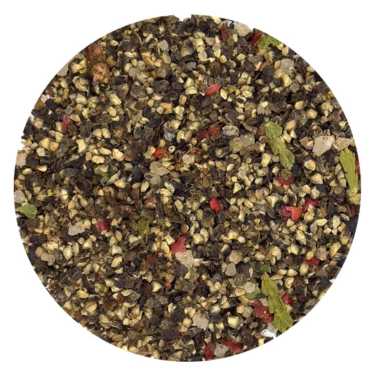Close-up texture of Boreal Pepper Mix with cracked peppercorns, dune pepper, sumac, and boreal herbs