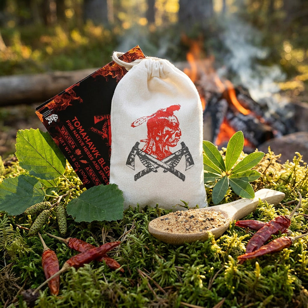 Tomahawk Blend seasoning pouch staged in boreal moss beside campfire with ghost peppers and northern herbs