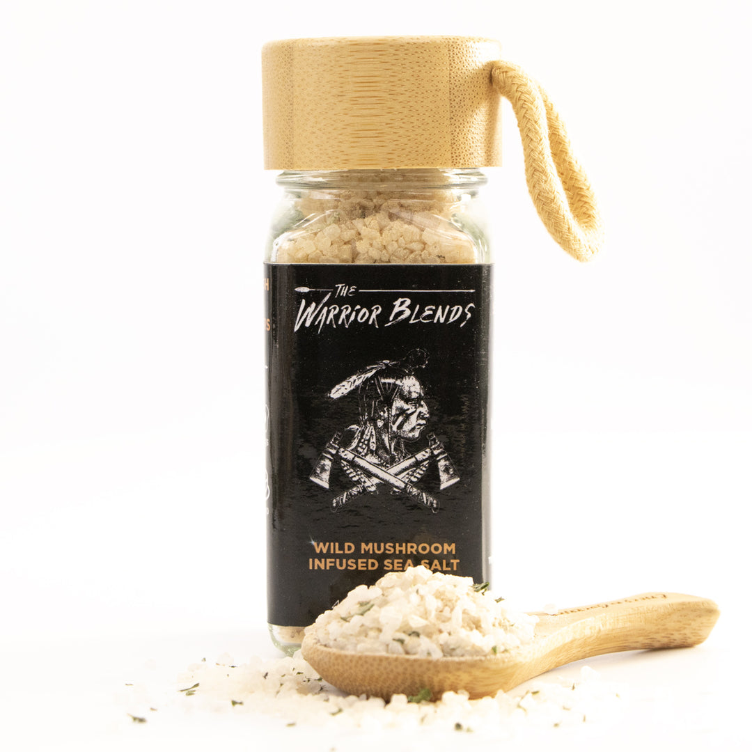 Wild Mushroom Infused Sea Salt jar with bamboo cap and coarse mushroom salt on white background
