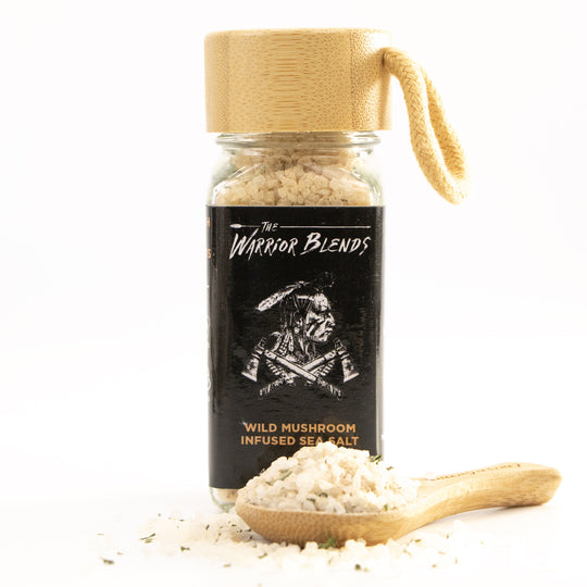 Wild Mushroom Infused Sea Salt jar with bamboo cap and coarse mushroom salt on white background