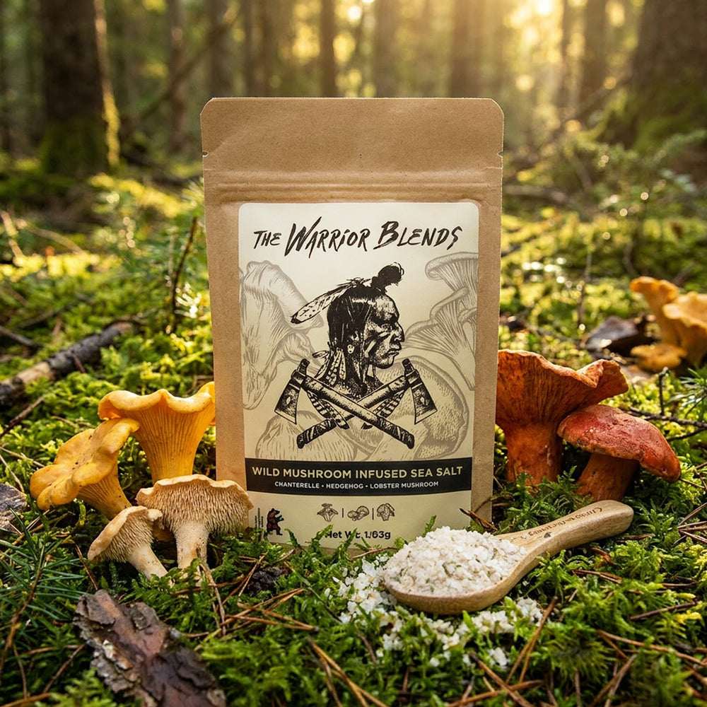 Wild Mushroom Infused Sea Salt pouch in boreal forest moss surrounded by chanterelle, hedgehog, and lobster mushrooms