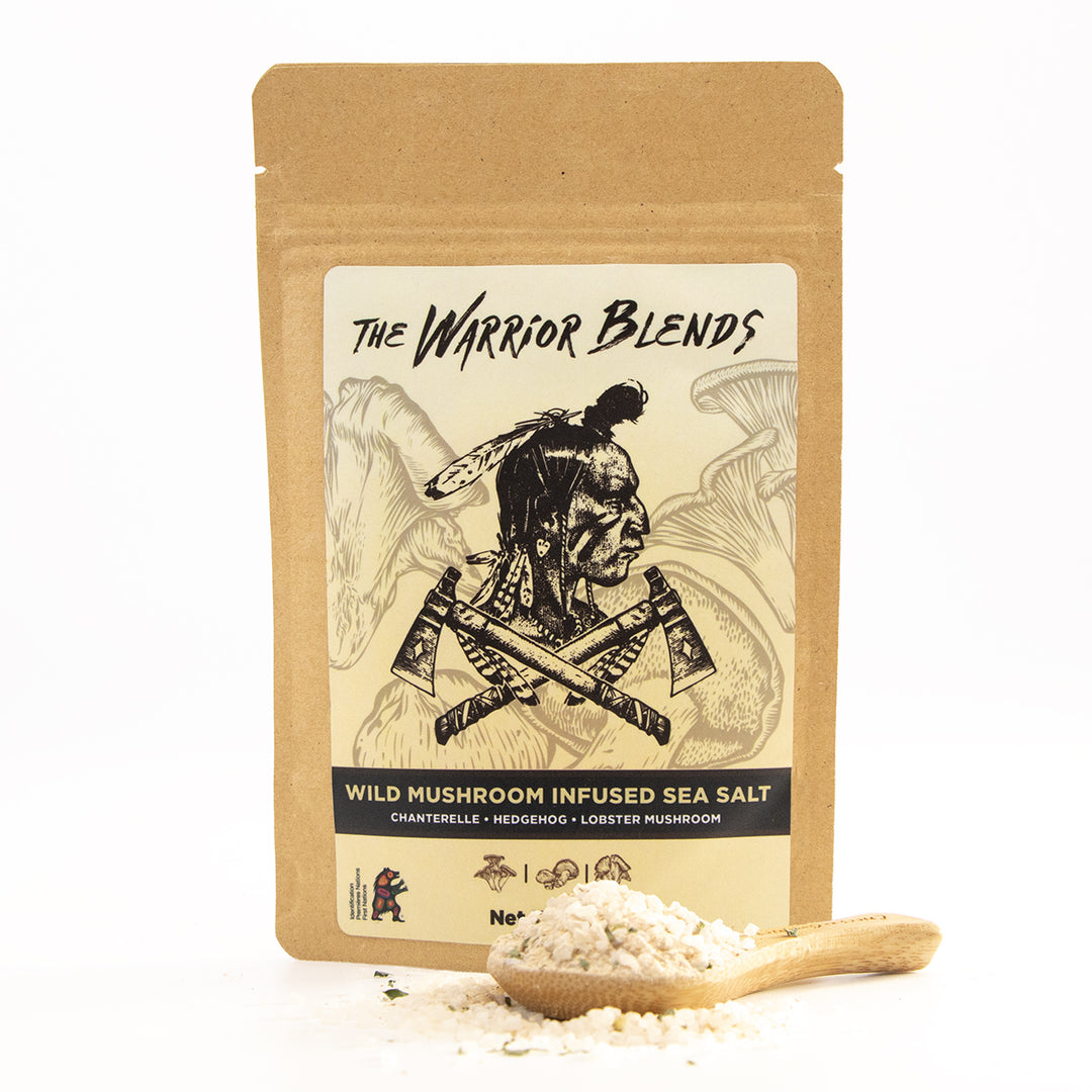 Wild Mushroom Infused Sea Salt pouch with wooden spoon on white background