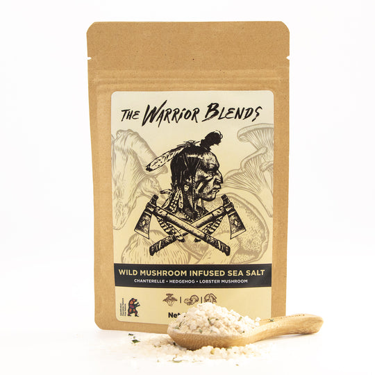 Wild Mushroom Infused Sea Salt pouch with wooden spoon on white background
